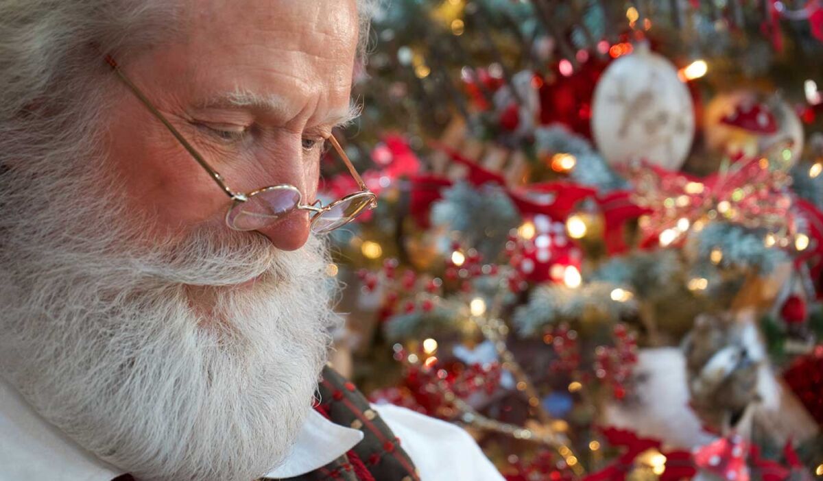 Santa beside the tree in Santa's House